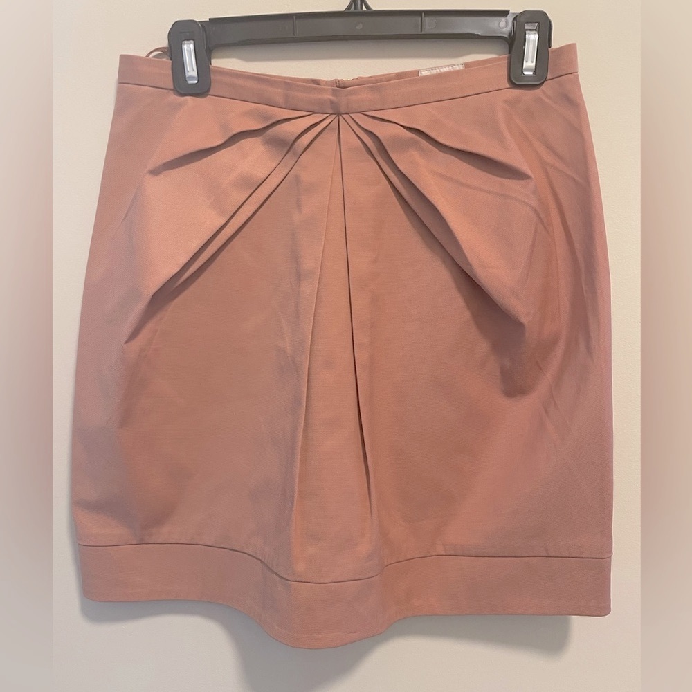 Size 8 blush colored pleated H&M mini skirt with back zipper. Fully lined.
